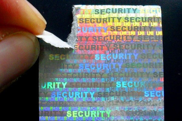 Silbernes Hologrammpapier mit Security-Endlostext zum preisgünstigen Versiegeln von Dokumenten und Verpackungen