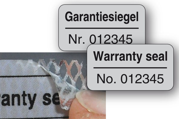 Garantiesiegel aus silberner Sicherheitsfolie mit rückseitigem Rautenmuster und fortlaufender Nummerierung
