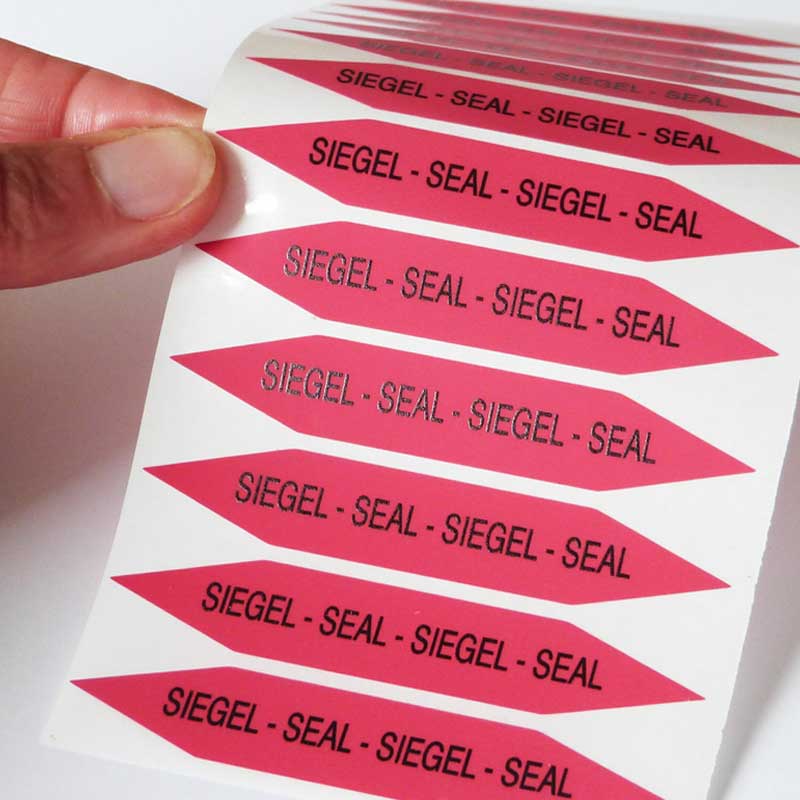 Warnendes Siegel aus auffälliger roter Void-Folie Auffällige Sicherheitsetiketten in Warn-Rot mit Text Siegel Seal in länglicher Form mit spitz zulaufenden Enden