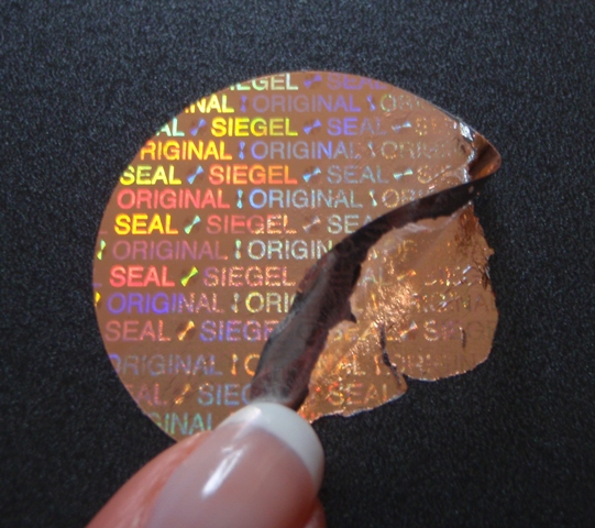 Kupferfarbene Hologramm-Etiketten mit Zerstör-Effekt bei unerlaubten Ablöseversuchen