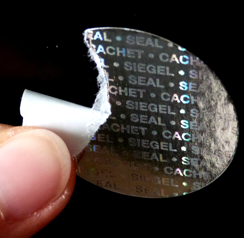 Siegelpunkte aus silbernem Hologrammpapier Silberne Papier-Holgrammaufkleber zerreißen bei Ablöseversuchen von der Verpackung
